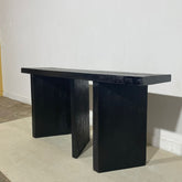 a black refrigerator freezer sitting in a room